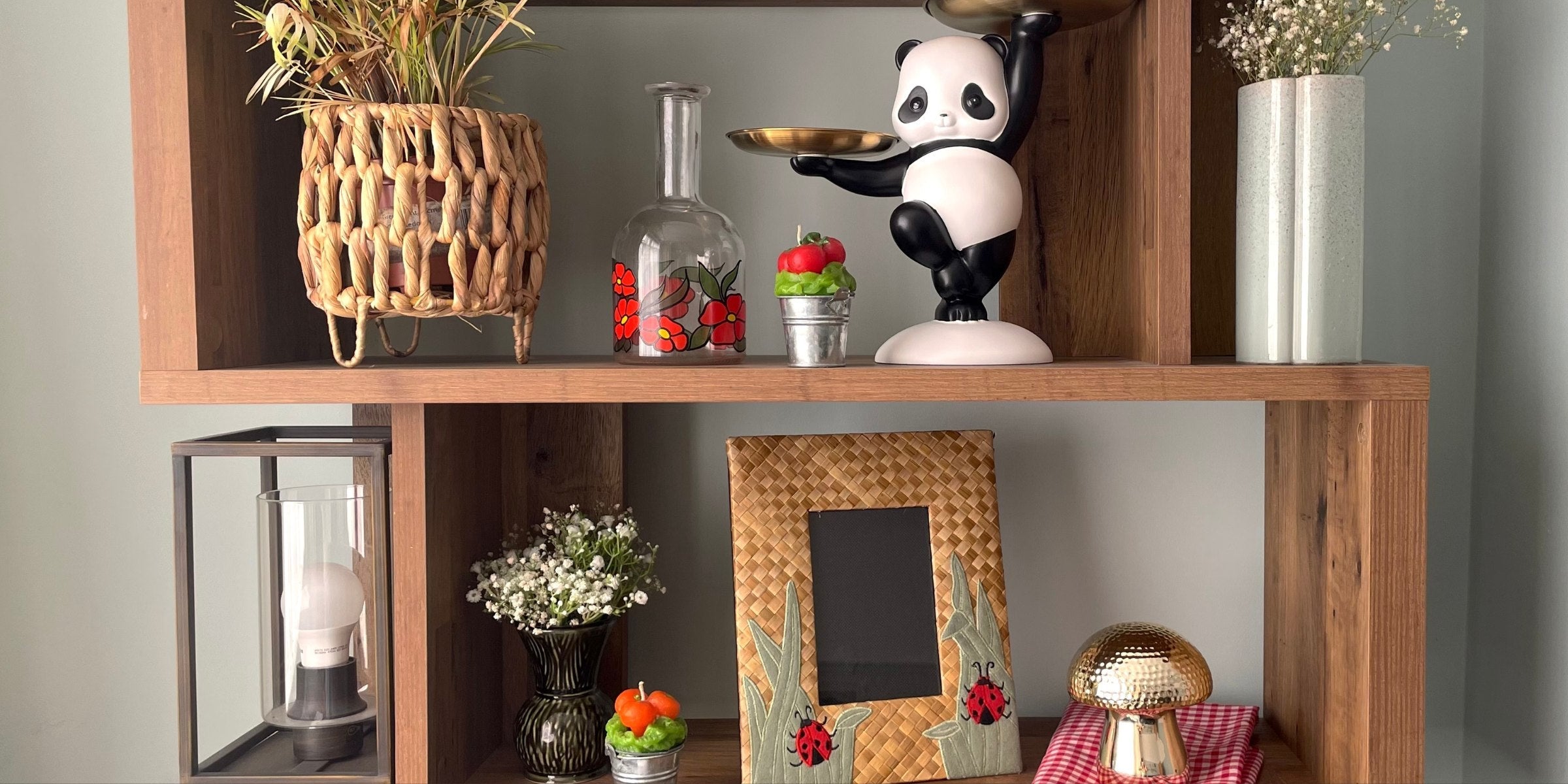 wooden shelving unit with a selection of unique home decor items on