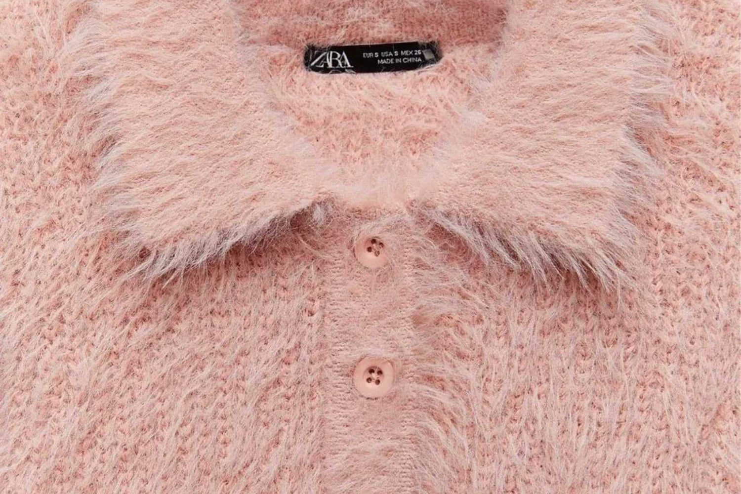 close up image of zara pink faux fur polo shirt focusing on the collar